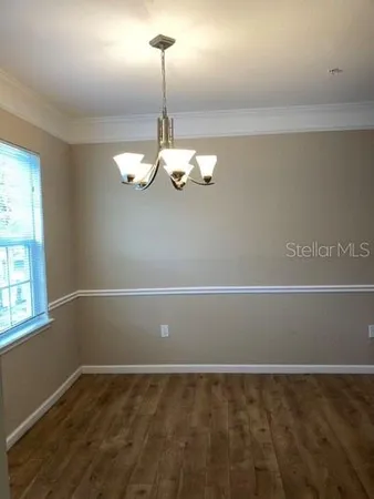 a kitchen with granite countertop a sink and a stove