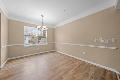 a kitchen with stainless steel appliances granite countertop a sink and a refrigerator