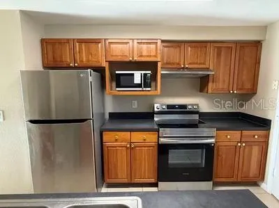 a kitchen with a sink and a window