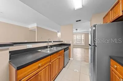 a white toilet sitting next to a bath tub