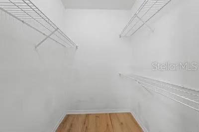 a view of an empty room and wooden floor