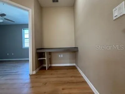 an aerial view of ocean and residential houses with outdoor space