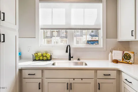 a bathroom with a sink and a window