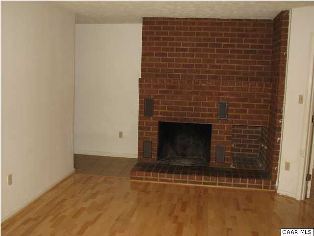 104 Turtle Creek Road, Unit 3 Charlottesville, VA 22901 - Photo 2 of 5 a view of empty room with a fireplace