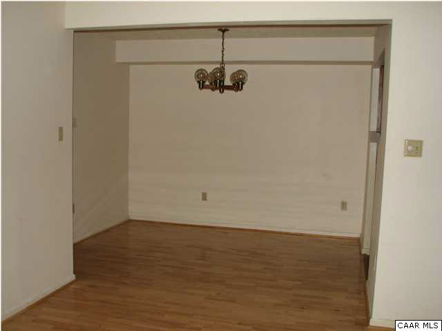 104 Turtle Creek Road, Unit 3 Charlottesville, VA 22901 - Photo 3 of 5 a view of a room with wooden floor