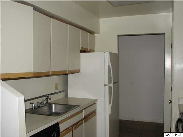 104 Turtle Creek Road, Unit 3 Charlottesville, VA 22901 - Photo 4 of 5 a kitchen with a refrigerator and sink