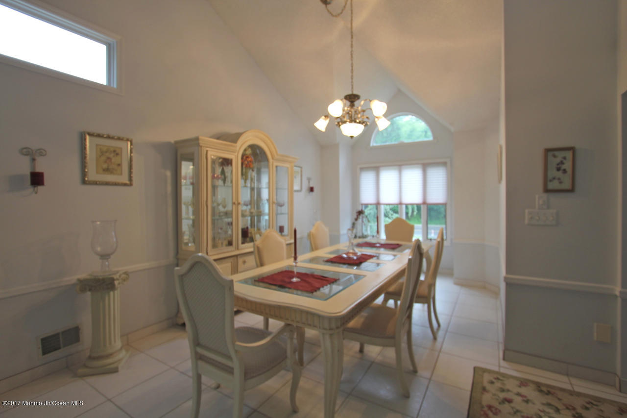 21 Jumping Brook Road Neptune Township, NJ 07753 - Photo 2 of 20 a view of a dining room with furniture window and wooden floor