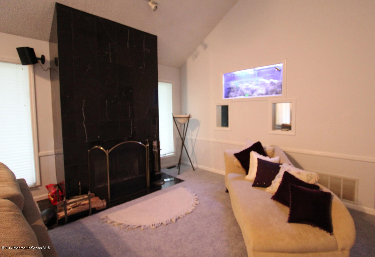 21 Jumping Brook Road Neptune Township, NJ 07753 - Photo 12 of 20 a bedroom with a bed and furniture
