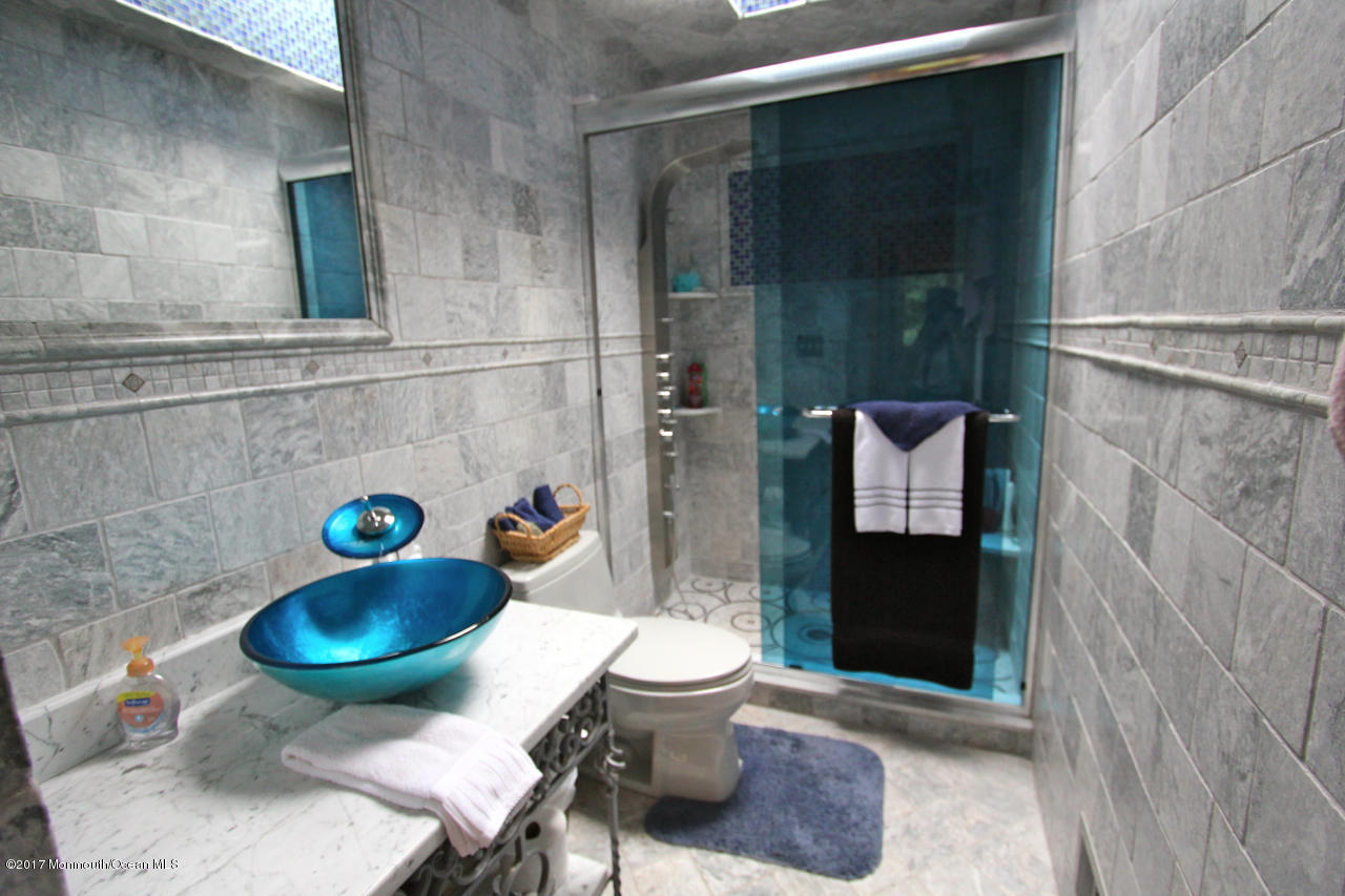 21 Jumping Brook Road Neptune Township, NJ 07753 - Photo 14 of 20 a bathroom with a toilet and a shower