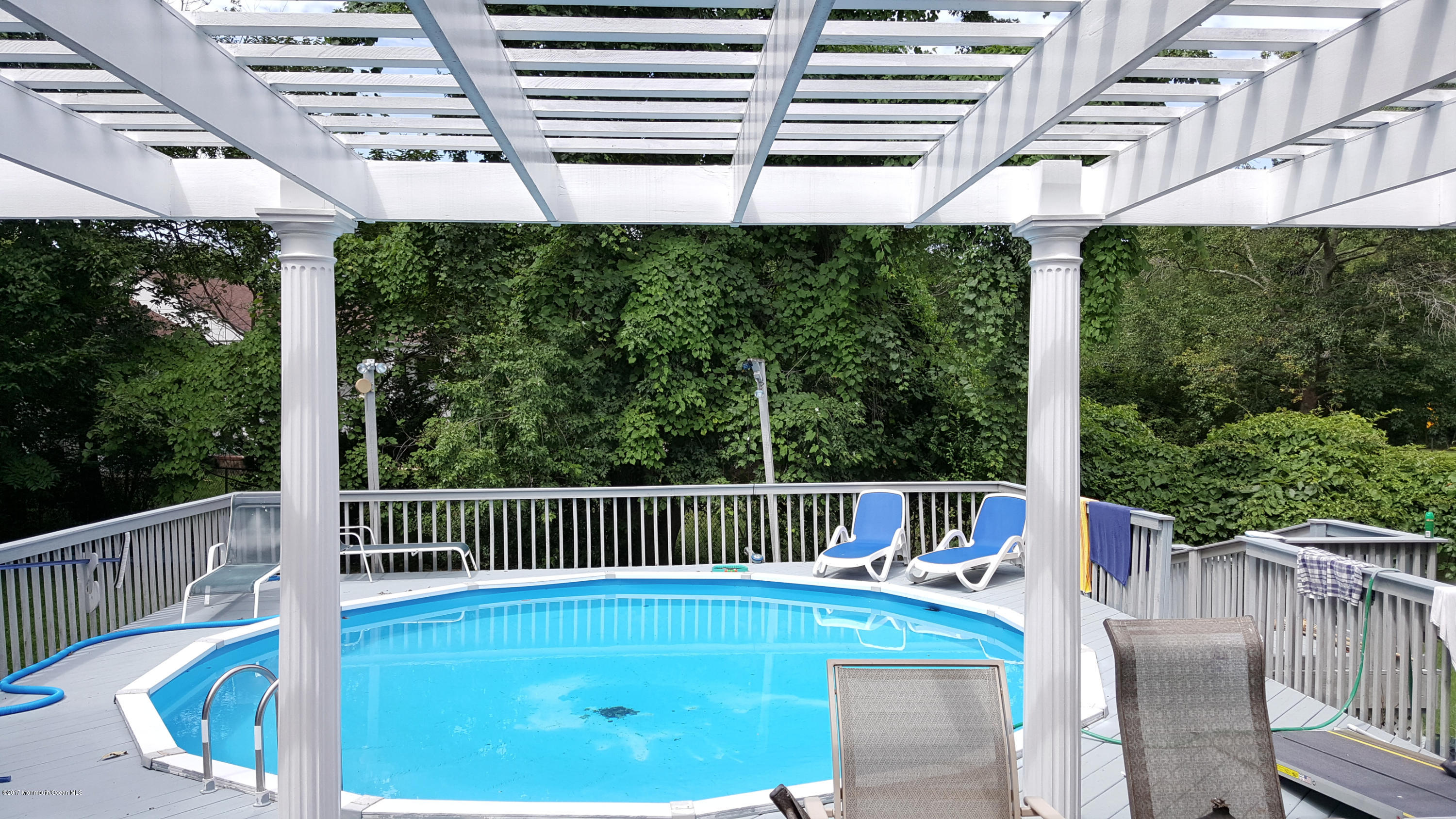 21 Jumping Brook Road Neptune Township, NJ 07753 - Photo 15 of 20 a view of a chair and tables front of the house