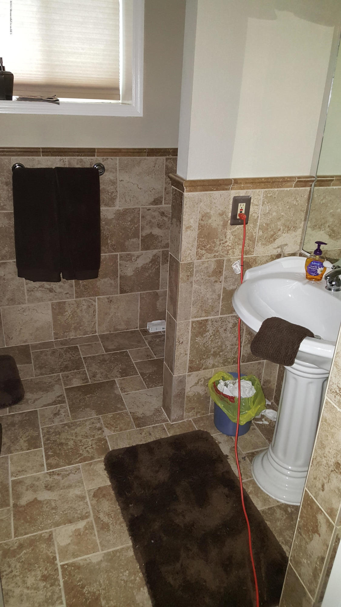 21 Jumping Brook Road Neptune Township, NJ 07753 - Photo 16 of 20 a bathroom with a sink and a mirror
