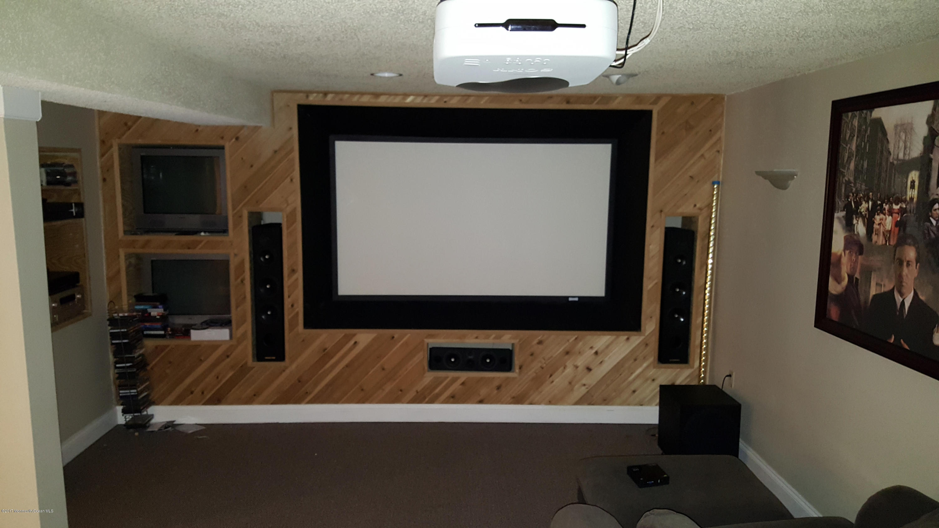 21 Jumping Brook Road Neptune Township, NJ 07753 - Photo 19 of 20 a living room with a flat screen tv