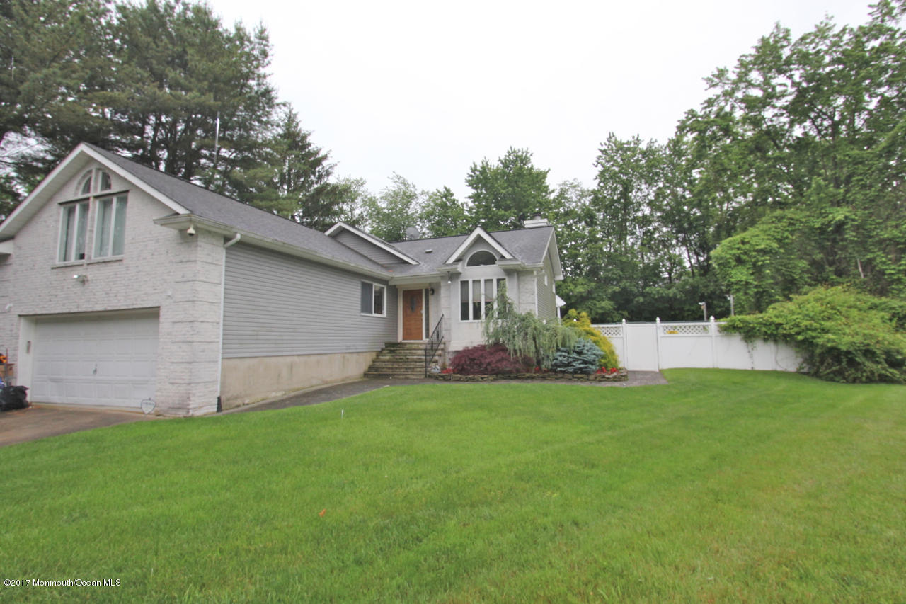 21 Jumping Brook Road Neptune Township, NJ 07753 - Photo 20 of 20 a view of a house with a yard and sitting area