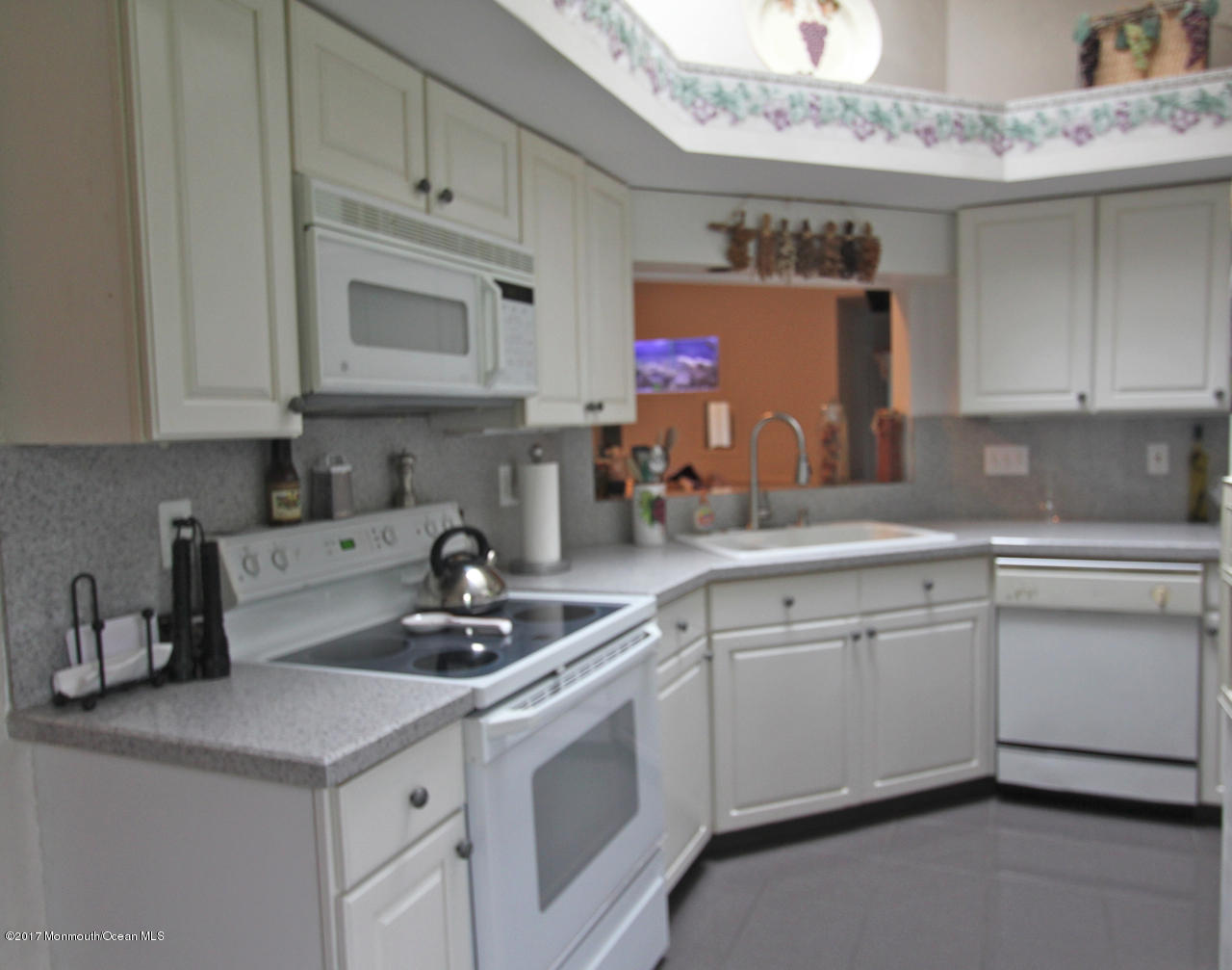 21 Jumping Brook Road Neptune Township, NJ 07753 - Photo 3 of 20 a kitchen with stainless steel appliances granite countertop a sink stove and cabinets