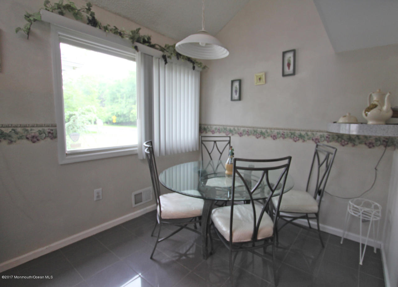 21 Jumping Brook Road Neptune Township, NJ 07753 - Photo 4 of 20 a view of a dining room with furniture and window