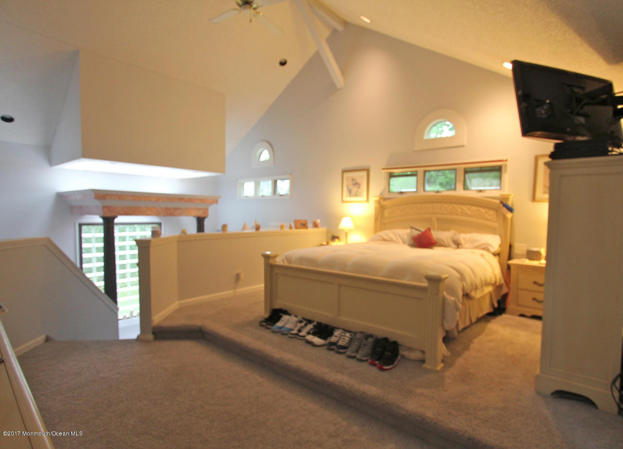 21 Jumping Brook Road Neptune Township, NJ 07753 - Photo 6 of 20 a bed room with a bed and a television