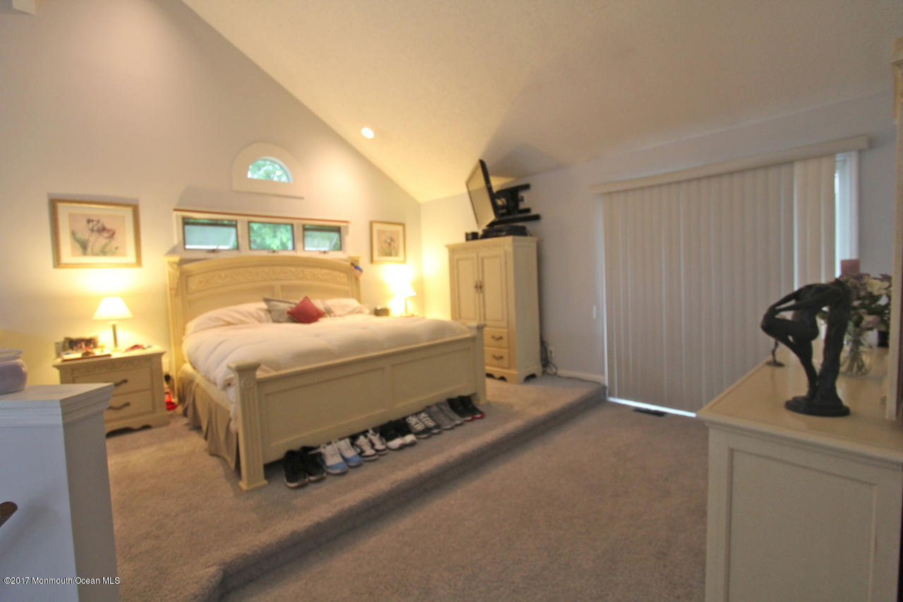 21 Jumping Brook Road Neptune Township, NJ 07753 - Photo 7 of 20 a bedroom with a bed and a window