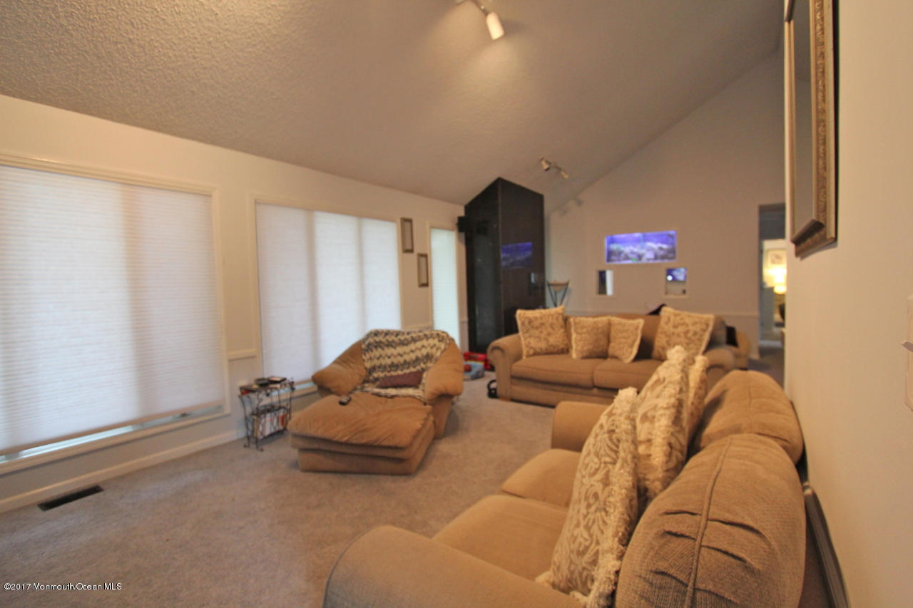 21 Jumping Brook Road Neptune Township, NJ 07753 - Photo 10 of 20 a bedroom with furniture and a window
