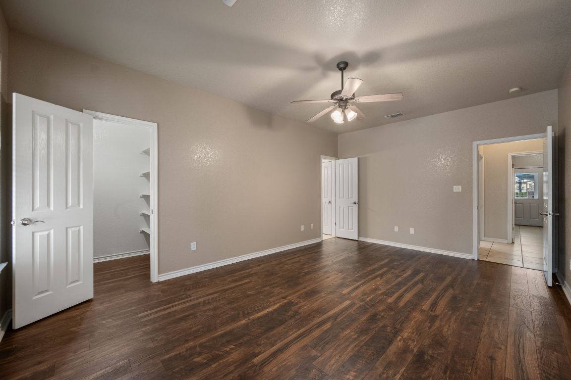 686 Benchmark Trail Belton, TX 76513 - Photo 24 of 38 wooden floor in an empty room with a window