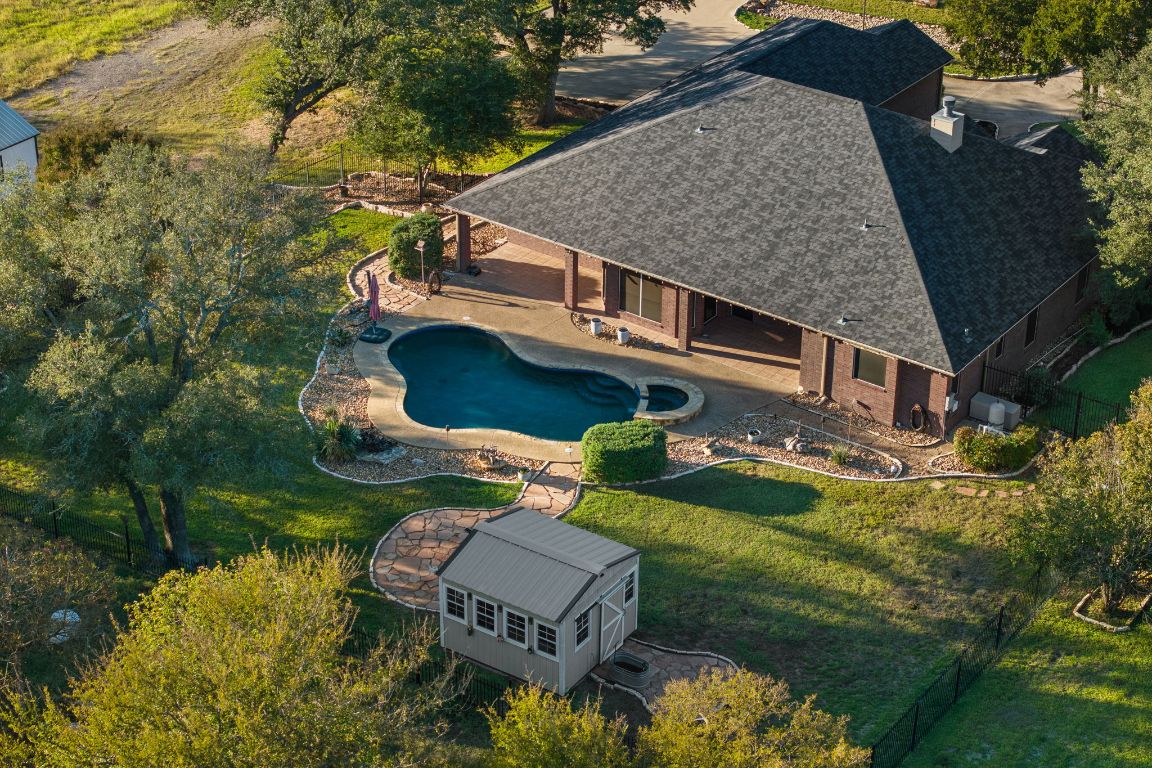 686 Benchmark Trail Belton, TX 76513 - Photo 33 of 38 an aerial view of a house with swimming pool a yard and a patio