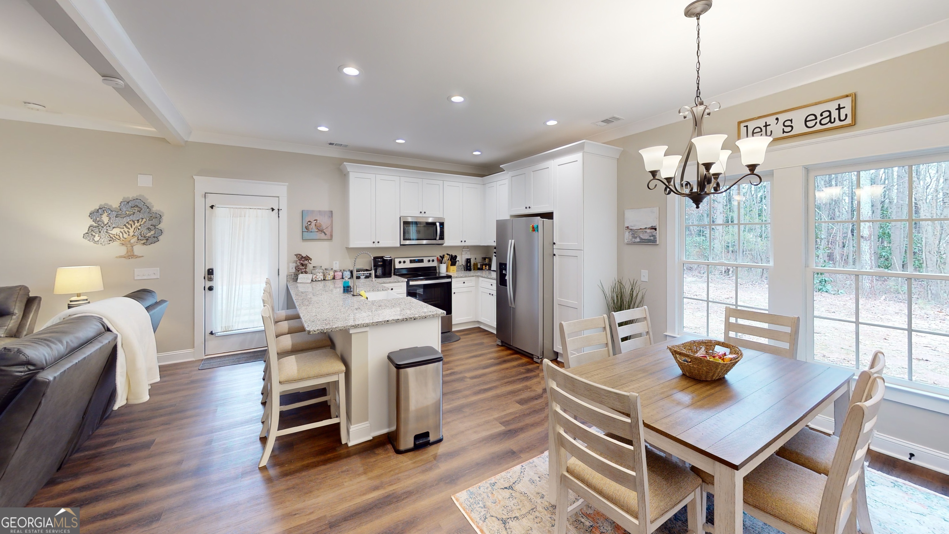 40 Luther Knight Road Southeast Cartersville, GA 30121 - Photo 11 of 22 a living room with furniture and a chandelier