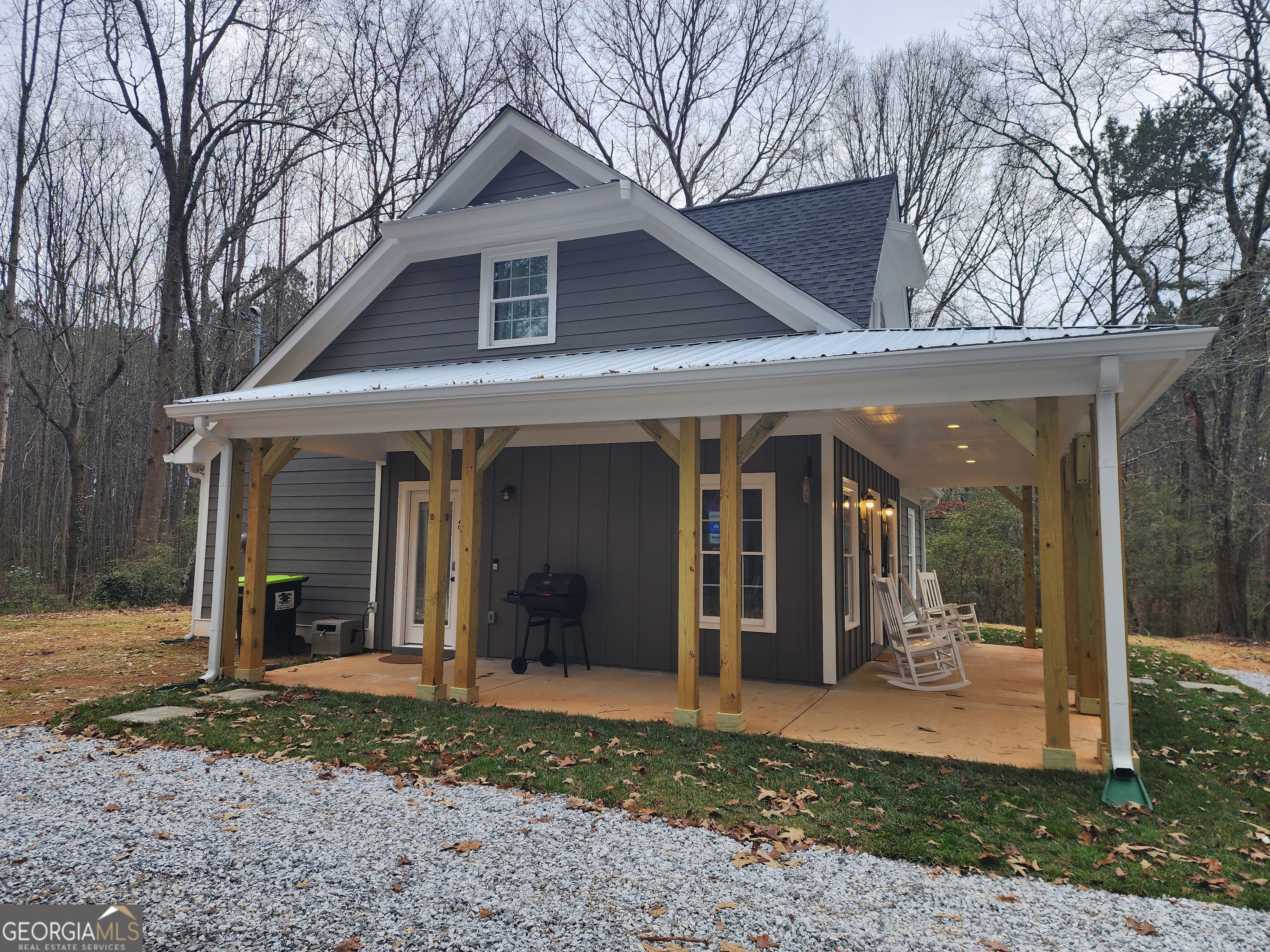 40 Luther Knight Road Southeast Cartersville, GA 30121 - Photo 14 of 22 a front view of a house with a yard and seating space