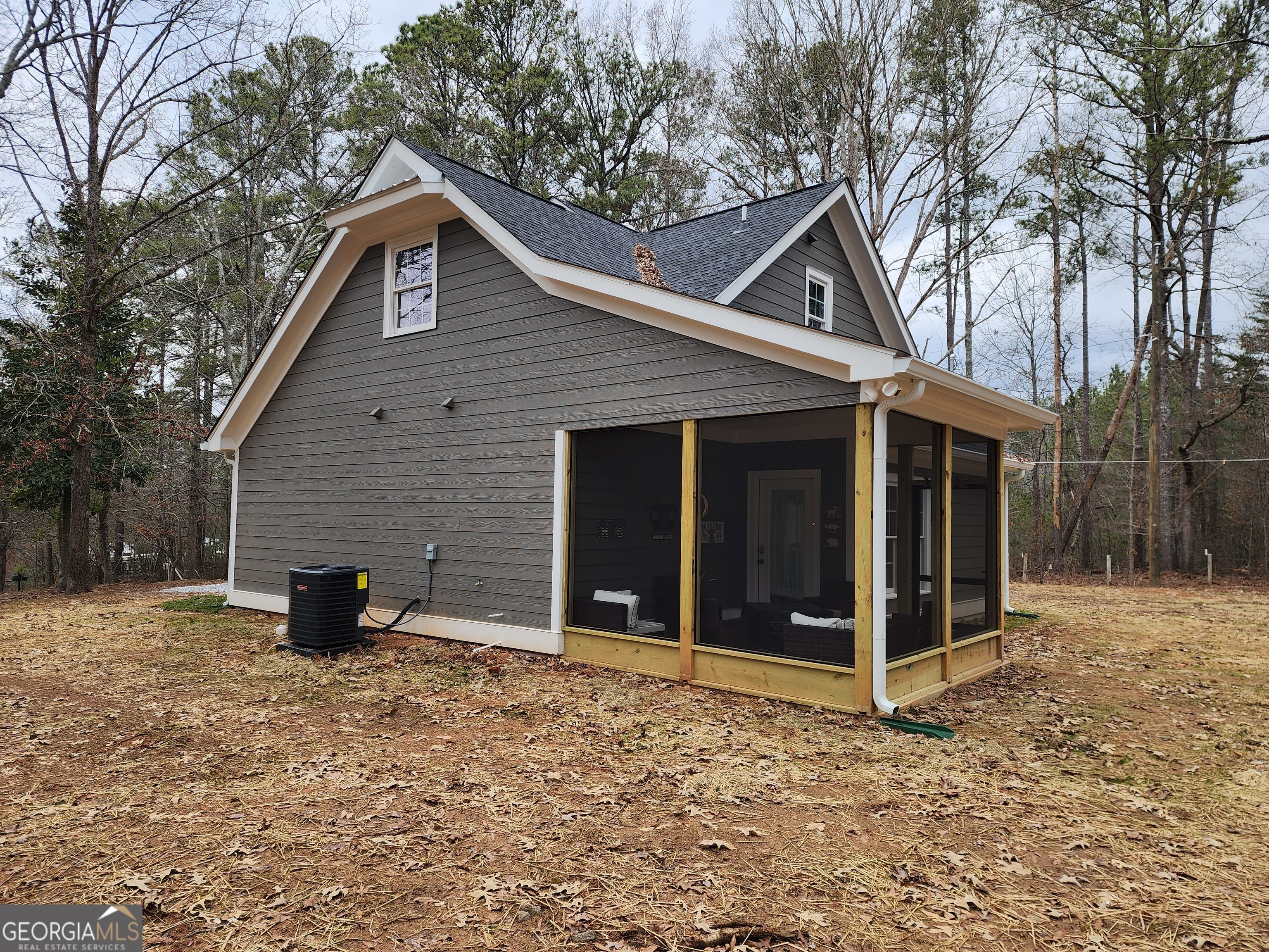 40 Luther Knight Road Southeast Cartersville, GA 30121 - Photo 16 of 22 a backyard of a house with barbeque oven and brick wall