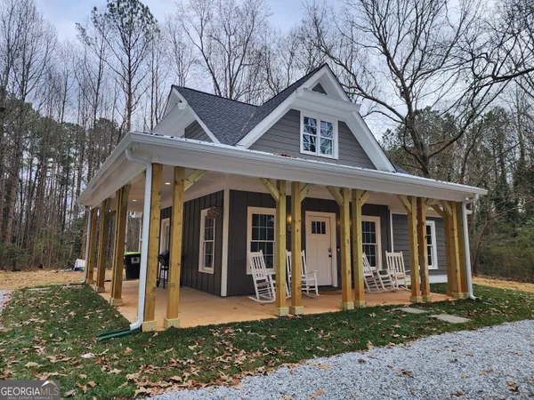 a front view of a house with a porch