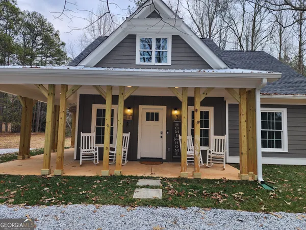 a front view of a house with a porch