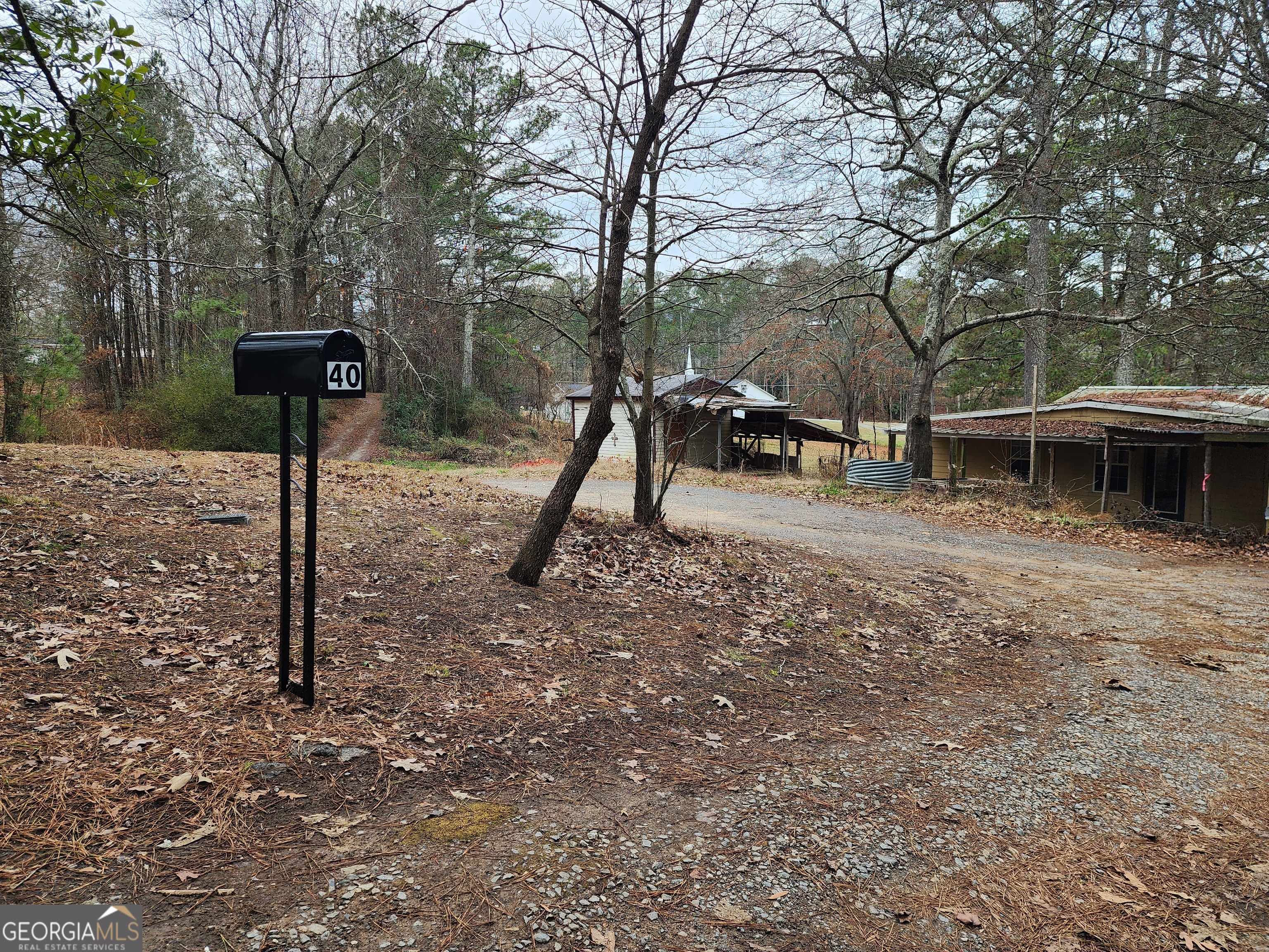 40 Luther Knight Road Southeast Cartersville, GA 30121 - Photo 22 of 22 a view of a park with a bench and trees