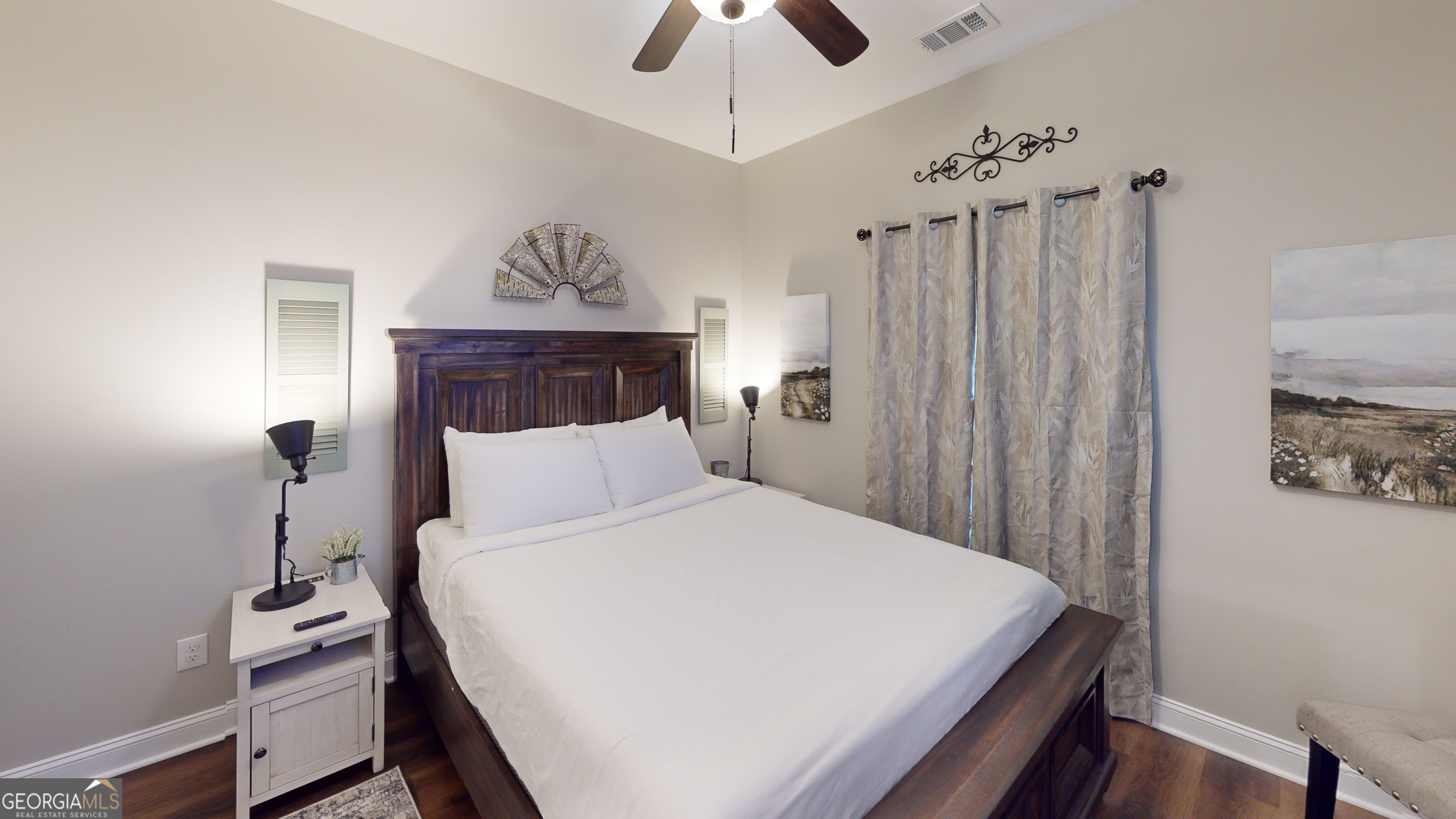 40 Luther Knight Road Southeast Cartersville, GA 30121 - Photo 6 of 22 a bedroom with a bed and a chandelier