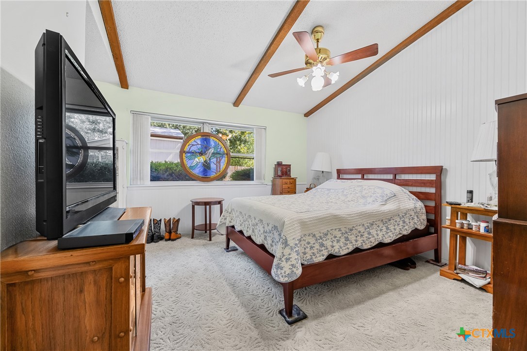 3909 Fairway Drive Temple, TX 76502 - Photo 11 of 24 a spacious bedroom with a bed and a flat screen tv