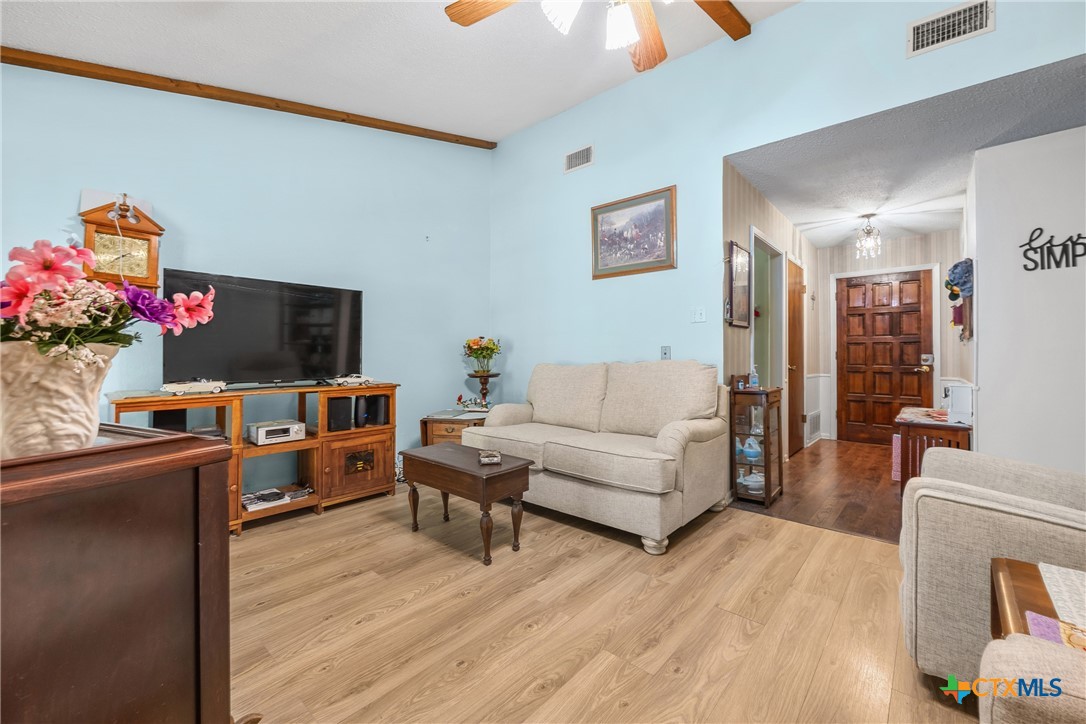 3909 Fairway Drive Temple, TX 76502 - Photo 4 of 24 a living room with furniture and a flat screen tv