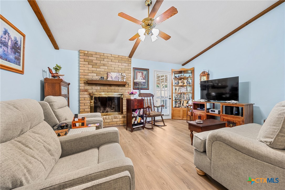 3909 Fairway Drive Temple, TX 76502 - Photo 5 of 24 a living room with furniture a fireplace and a flat screen tv