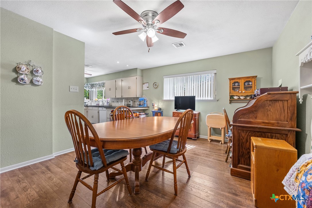 3909 Fairway Drive Temple, TX 76502 - Photo 10 of 24 a view of a dining room with furniture and wooden floor