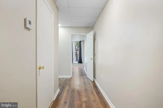 a kitchen with a refrigerator a sink and cabinets