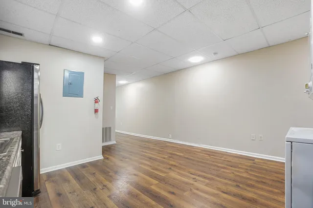 a large kitchen with stainless steel appliances granite countertop a stove and a refrigerator