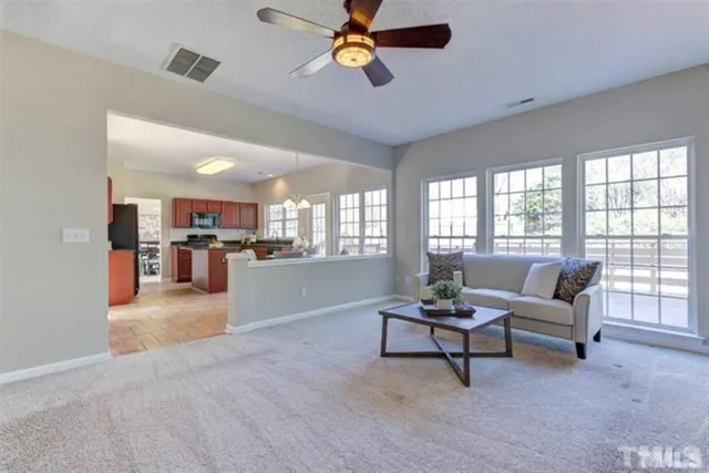 a living room with furniture and a window