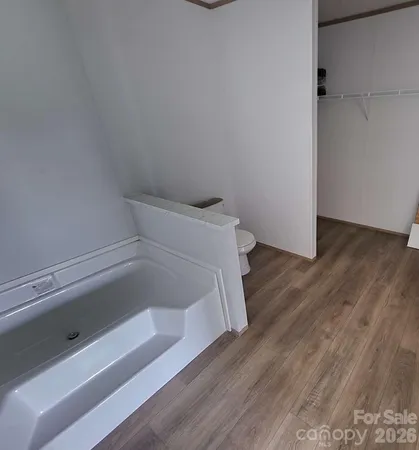 a storage room with wooden floor