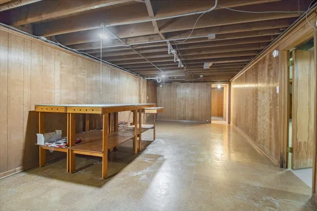 a view of an empty room with wooden roof