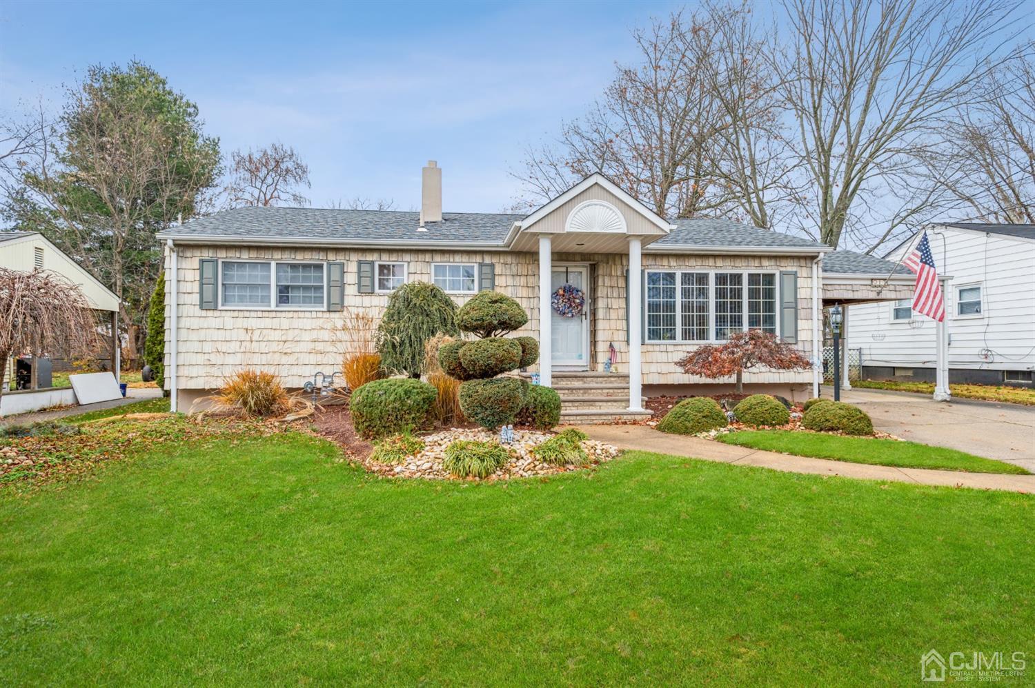 17 Longview Road Old Bridge, NJ 08857 - Photo 1 of 18 a front view of a house with a yard and porch