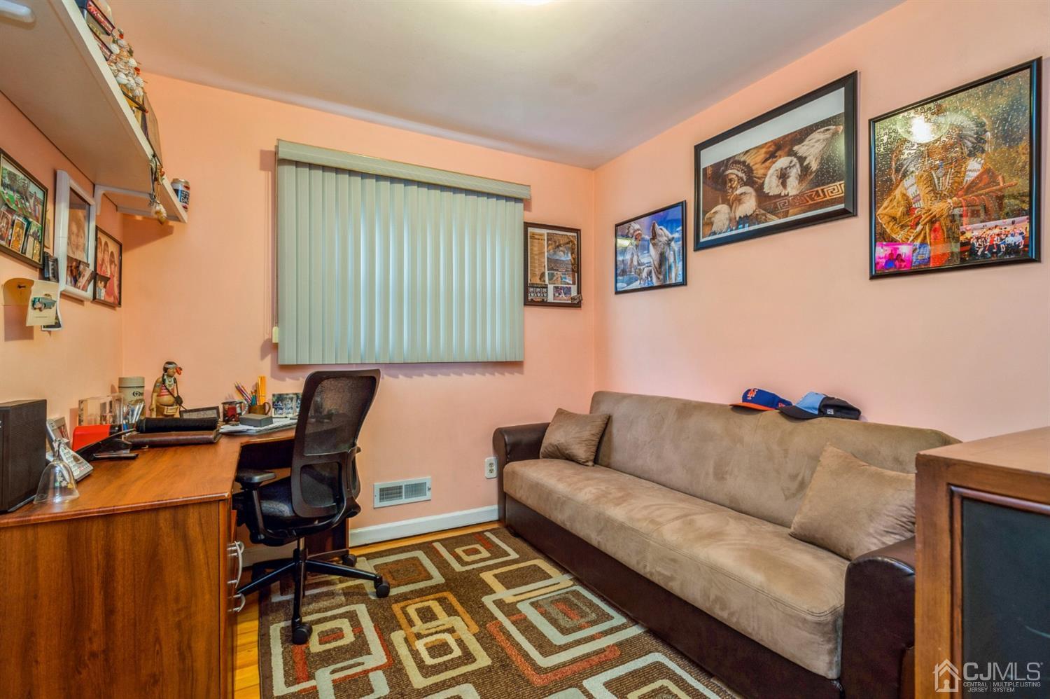 17 Longview Road Old Bridge, NJ 08857 - Photo 12 of 18 a living room with furniture and a flat screen tv