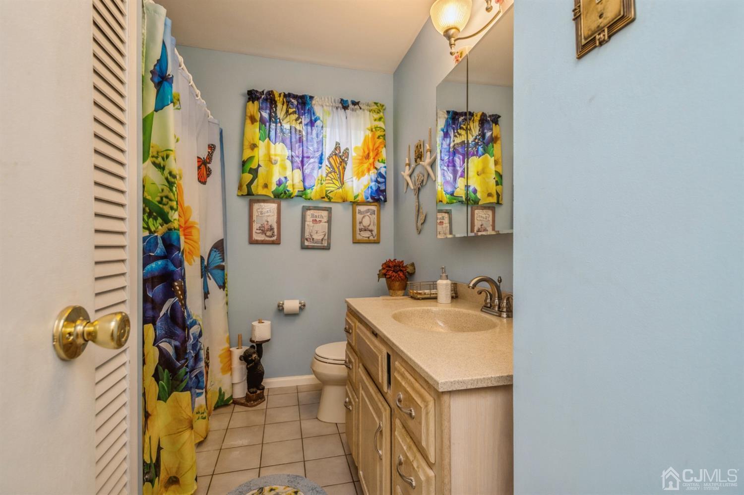 17 Longview Road Old Bridge, NJ 08857 - Photo 13 of 18 a bathroom with a sink mirror and vanity