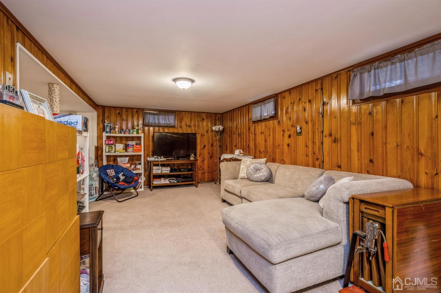 17 Longview Road Old Bridge, NJ 08857 - Photo 15 of 18 a living room with furniture and a flat screen tv