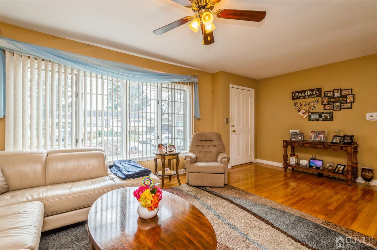 17 Longview Road Old Bridge, NJ 08857 - Photo 7 of 18 a living room with furniture and a floor to ceiling window