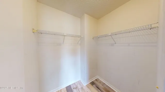 a view of a room with racks on the wall