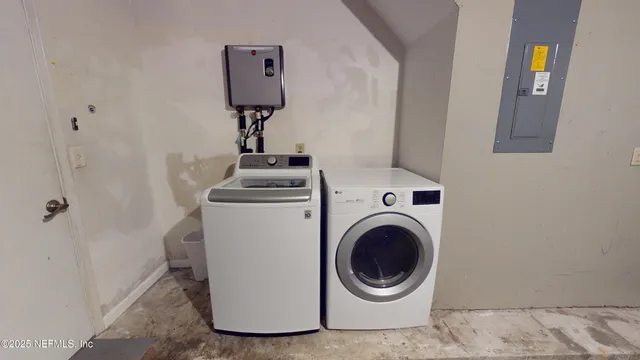 a utility room with dryer and washer