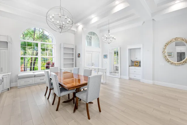 a spacious en suite bathroom with a double vanity sink a mirror and a shower