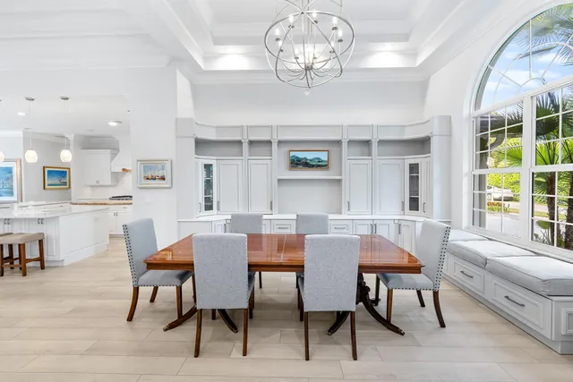a spacious bathroom with a granite countertop sink toilet a shower and a mirror
