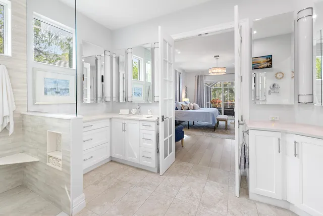 a bedroom with a bed and a lamp on table